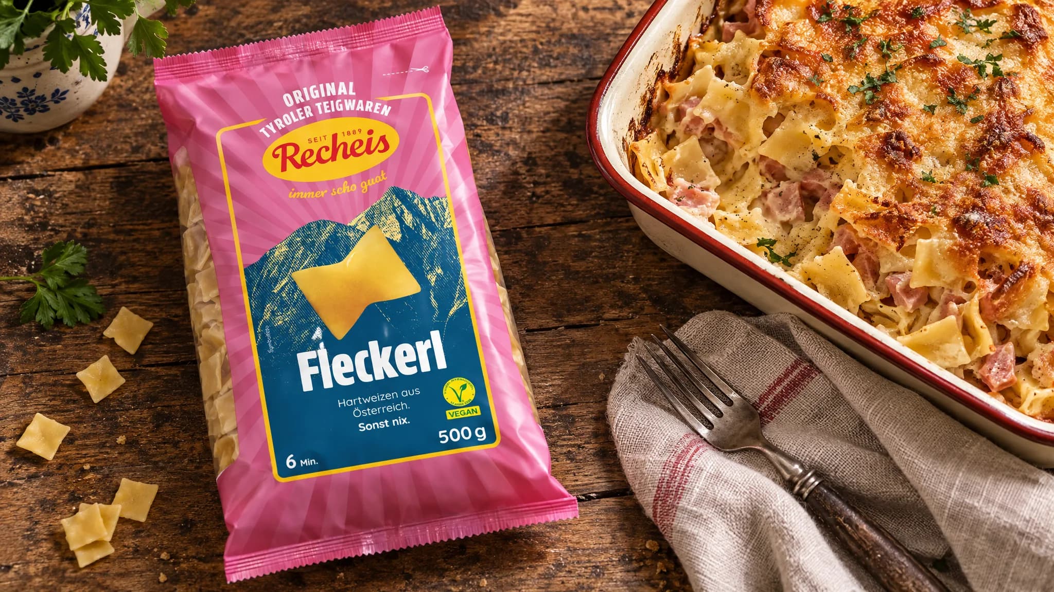 Recheis Fleckerl next to a dish of baked Schinkenfleckerl
